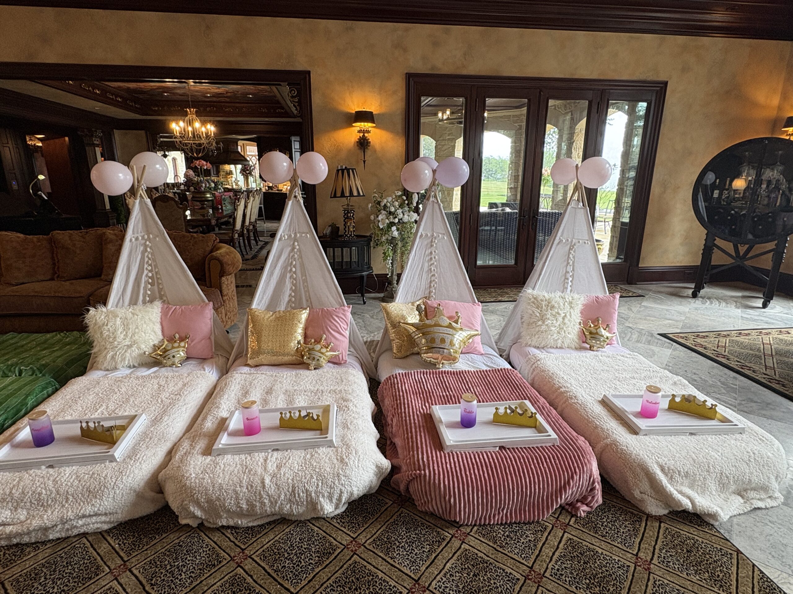 four beds set up in the princess theme